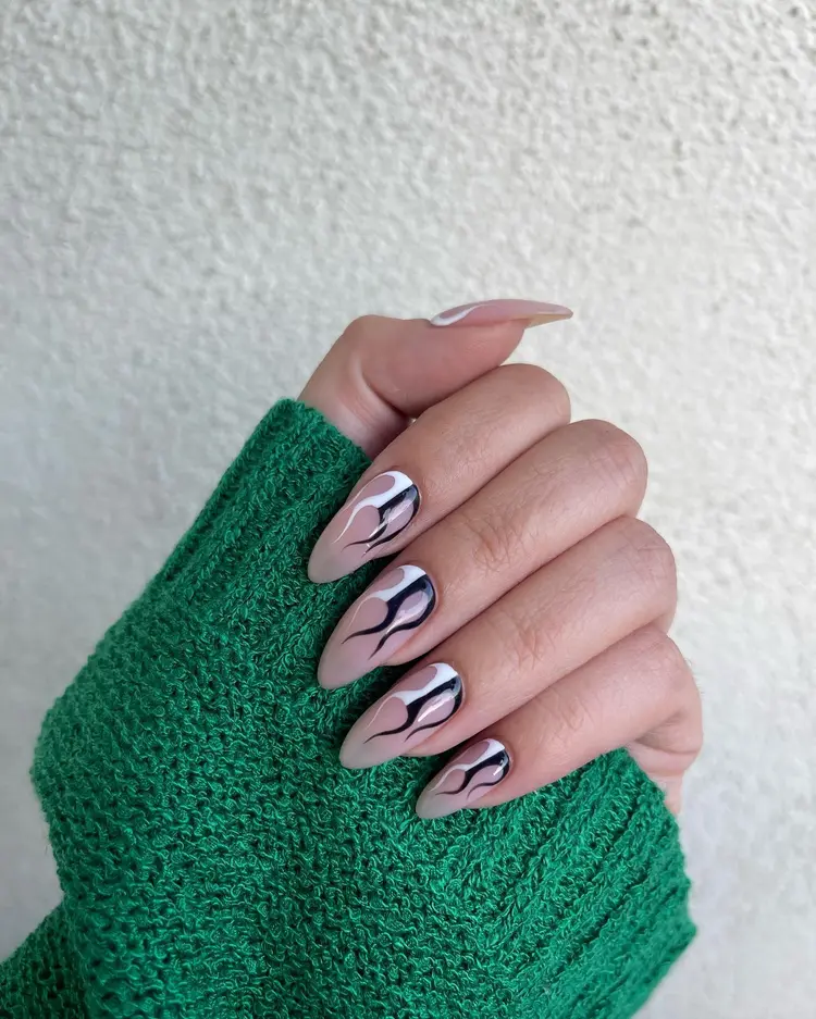 Minimal swirl design on almond nails